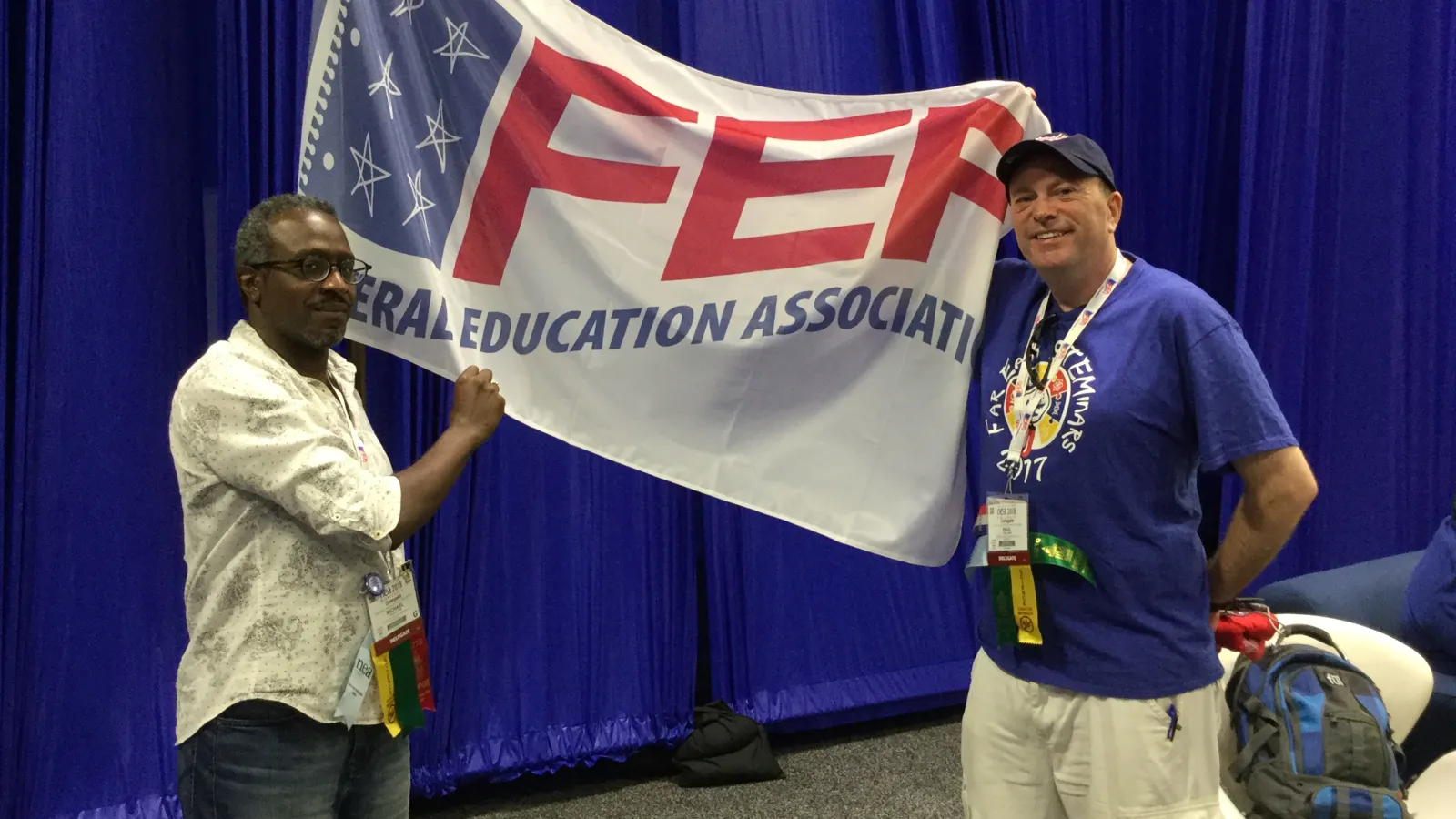Pope and Lundy with FEA banner