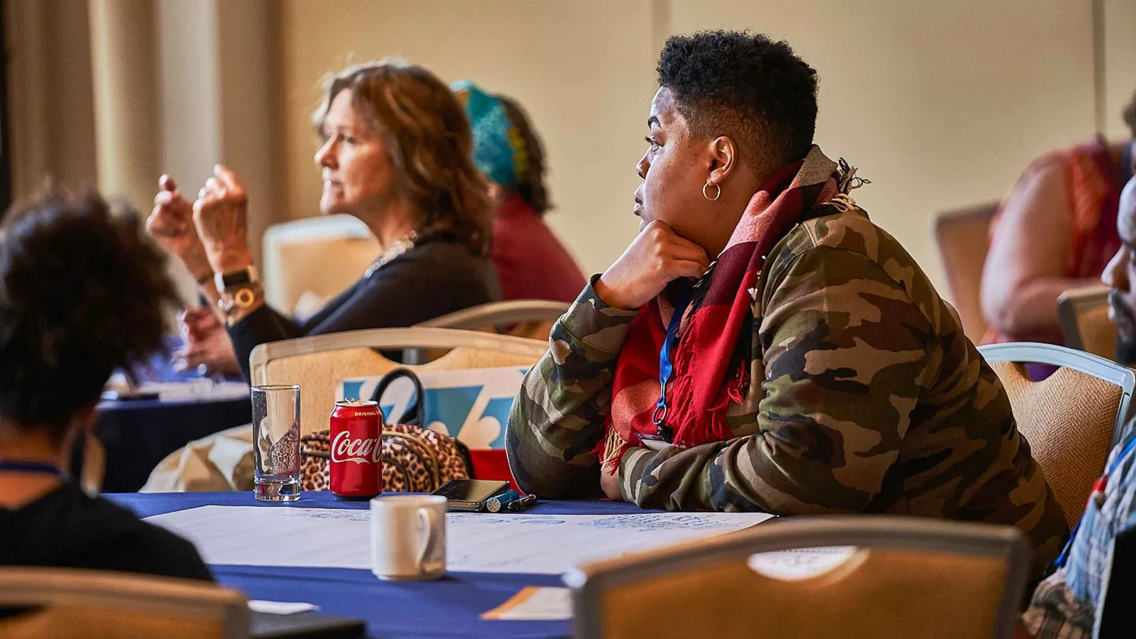 Attendees speak at a professional development conference